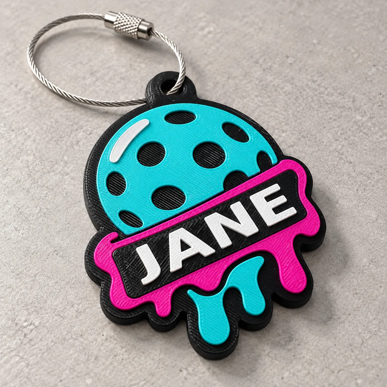 Close view of the raised JANE lettering and layered Rally Melt design