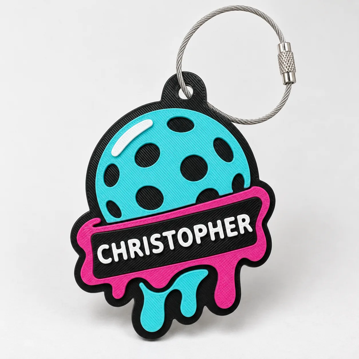 Rally Melt tag personalized with CHRISTOPHER on a light studio background